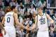 Dec 7, 2013; Salt Lake City, UT, USA; Utah Jazz center Enes Kanter (0) and shooting guard Gordon Hayward (20) react during the second half against the Sacramento Kings at EnergySolutions Arena. Sacramento won in overtime 112-102. Mandatory Credit: Russ Is