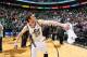 SALT LAKE CITY, UT - APRIL 14: Gordon Hayward #20 and other players of the Utah Jazz throw autographed balls into the crowd after the game against the Los Angeles Lakers at EnergySolutions Arena on April 14, 2014 in Salt Lake City, Utah. NOTE TO USER: Us