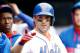 NEW YORK, NY - MAY 28: David Wright #5 of the New York Mets celebrates in the dugout after his solo home run in the sixth inning against the Pittsburgh Pirates on May 28, 2014 at Citi Field in the Flushing neighborhood of the Queens borough of New York C