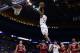 Mar 21, 2014; St. Louis, MO, USA; Kansas Jayhawks guard Andrew Wiggins (22) dunks the ball ahead of Eastern Kentucky Colonels guard Isaac McGlone (5), Glenn Cosey (0) and Marcus Lewis (12) in the first half during the 2nd round of the 2014 NCAA Men's Bask