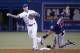 TORONTO, CANADA - JUNE 9: Brett Lawrie #13 of the Toronto Blue Jays turns a double play in the sixth inning during a MLB game as Kendrys Morales #17 of the Minnesota Twins slides into second base on June 9, 2014 at Rogers Centre in Toronto, Ontario, Canad