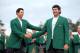 AUGUSTA, GA - APRIL 13: Adam Scott of Australia presents Bubba Watson of the United States with the green jacket after Watson won the 2014 Masters Tournament by a three-stroke margin at Augusta National Golf Club on April 13, 2014 in Augusta, Georgia. (