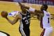 Jun 10, 2014; Miami, FL, USA; San Antonio Spurs forward Boris Diaw (33) passes around Miami Heat center Chris Bosh (1) during the second half of game three of the 2014 NBA Finals at American Airlines Arena. Mandatory Credit: Bob Donnan-USA TODAY Sports