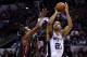 SAN ANTONIO, TX - JUNE 08: Tim Duncan #21 of the San Antonio Spurs takes a shot over Chris Bosh #1 of the Miami Heat during Game Two of the 2014 NBA Finals at the AT&T Center on June 8, 2014 in San Antonio, Texas. NOTE TO USER: User expressly acknowledge
