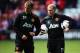 Former teammates Phil Neville and Paul Scholes have offered contrasting views of Rooney's current form and importance.