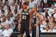 MIAMI, FL - JUNE 12: Tim Duncan #21 and Tony Parker #9 of the San Antonio Spurs share a moment on the sidelines against the Miami Heat during Game Six of the 2014 NBA Finals on June 12, 2014 at American Airlines Arena in Miami, Florida. NOTE TO USER: User