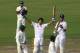 DHAKA, BANGLADESH - MARCH 24: England captain Alastair Cook raises his bat after reaching his century as Kevin Pietersen (r) applauds during day five of the 2nd Test match between Bangladesh and England at Shere-e-Bangla National Stadium on March 24, 2010