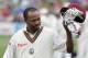 WELLINGTON, NEW ZEALAND - MARCH 19: Brian Lara of the West Indies lifts his cap to the crowd as he leaves the field after being caught out for one run by Hamish Marshall of the New Zealand BlackCaps during day three of the second test match between New Ze