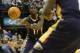 Jan 4, 2014; Indianapolis, IN, USA; New Orleans Pelicans point guard Jrue Holiday (11) passes the ball to New Orleans Pelicans point guard Tyreke Evans (1) during the second half of the game against the Indiana Pacers at Bankers Life Fieldhouse. Indiana