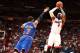 MIAMI, FL - APRIL 6: LeBron James #6 of the Miami Heat shoots over Carmelo Anthony #7 of the New York Knicks during a game on April 6, 2014 at American Airlines Arena in Miami, Florida. NOTE TO USER: User expressly acknowledges and agrees that, by downlo