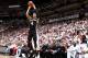 MIAMI, FL - JUNE 12: Miami Heat players watch as Danny Green #4 of the San Antonio Spurs shoots a three pointer during Game Four of the 2014 NBA Finals at American Airlines Arena in Miami, Florida on June 12, 2014. NOTE TO USER: User expressly acknowledg