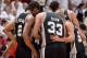 MIAMI, FL - JUNE 10: Kawhi Leonard #2, Danny Green #4, Boris Diaw #33, Tony Parker #9 and Tim Duncan #21 of the San Antonio Spurs huddle during Game Three of the 2014 NBA Finals between the Miami Heat and San Antonio Spurs at the American Airlines Arena o