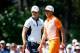 PINEHURST, NC - JUNE 15: (L-R) Martin Kaymer of Germany and Rickie Fowler of the United States look on from the second green during the final round of the 114th U.S. Open at Pinehurst Resort & Country Club, Course No. 2 on June 15, 2014 in Pinehurst, Nor