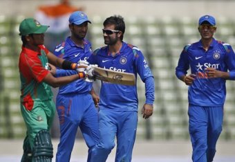 Parvez Rasool (second from right) and Akshar Patel (right) made their debuts for India.