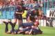 Jurgen Klinsmann's team-mates bundle on him after the German scored on his Tottenham debut against Sheffield Wednesday in August 1994.