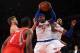 NEW YORK, NY - NOVEMBER 14: Carmelo Anthony #7 of the New York Knicks grabs a rebound over Terrence Jones #6 and Chandler Parsons #25 of the Houston Rockets during the second half at Madison Square Garden on November 14, 2013 in New York City. The Rockets