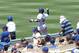 LOS ANGELES, CA - JUNE 15: Right fielder Yasiel Puig #66 of the Los Angeles Dodgers throws to second base to get Cody Ross of the Arizona Diamondbacks trying to stretch a single for the third out of the the top of the fifth inning at Dodger Stadium on J