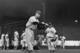 BOSTON, MA - CIRCA 1945: (UNDATED FILE PHOTO) Baseball legend Ted Williams (1919 - 2002) of the Boston Red Sox swings a bat at a ball during a pre-game practice as Walter 'Smokey' Baker, the 13-year-old son of Red Sox pitching coach Del Baker (1892 - 19