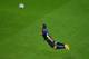 SALVADOR, BRAZIL - JUNE 13: Robin van Persie of the Netherlands scores the team's first goal with a diving header in the first half during the 2014 FIFA World Cup Brazil Group B match between Spain and Netherlands at Arena Fonte Nova on June 13, 2014 in