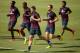 RIO DE JANEIRO, BRAZIL - JUNE 16: (L-R) Danny Welbeck, Glen Johnson, Steven Gerrard, Jordan Henderson and Raheem Sterling of England warm up during a training session at the Urca military base (Forte de Urca) training ground at on June 16, 2014 in Rio de