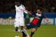 PARIS, FRANCE - NOVEMBER 05: Cheikhou Kouyate of Anderlecht (L) is tackled by Ezequiel Lavezzi of PSG during the UEFA Champions League Group C match between Paris Saint Germain and RSC Anderlecht at Parc des Princes on November 5, 2013 in Paris, France.