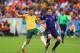 PORTO ALEGRE, BRAZIL - JUNE 18: Mathew Leckie of Australia competes for the ball with Daley Blind of the Netherlands during the 2014 FIFA World Cup Brazil Group B match between Australia and Netherlands at Estadio Beira-Rio on June 18, 2014 in Porto Alegr