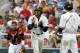 Jun 14, 2014; Omaha, NE, USA; Vanderbilt Commodores runner John Norwood (10) reacts after scoring against the Louisville Cardinals during game two of the 2014 College World Series at TD Ameritrade Park Omaha. Mandatory Credit: Bruce Thorson-USA TODAY Spor