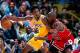 INGLEWOOD, CA - 1998: Kobe Bryant #8 of the Los angeles Lakers keeps the ball away from Michael Jordan #23 of the Chicago Bulls as he back in closer to the basket during an NBA game at The Great Western Forum in Inglewood, California. NOTE TO USER: Use