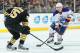BOSTON, MA - FEBRUARY 1: Jordan Eberle #14 of the Edmonton Oilers skates with the puck against Johnny Boychuk #55 of the Boston Bruins at the TD Garden on February 1, 2014 in Boston, Massachusetts. (Photo by Steve Babineau/NHLI via Getty Images)