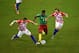 MANAUS, BRAZIL - JUNE 18: Alex Song of Cameroon controls the ball against Ivica Olic (L) and Ivan Rakitic of Croatia during the 2014 FIFA World Cup Brazil Group A match between Cameroon and Croatia at Arena Amazonia on June 18, 2014 in Manaus, Brazil. (P