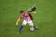MANAUS, BRAZIL - JUNE 18: Ivan Rakitic of Croatia and Enoh Eyong of Cameroon compete for the ball during the 2014 FIFA World Cup Brazil Group A match between Cameroon and Croatia at Arena Amazonia on June 18, 2014 in Manaus, Brazil. (Photo by Stu Forst