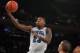 Mar 12, 2014; New York, NY, USA; Seton Hall Pirates guard/forward Fuquan Edwin (23) shoots the ball in front of Butler Bulldogs forward Andrew Chrabascz (45) during the first half in the first round of the Big East tournament at Madison Square Garden. Man