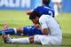Suarez checks his teeth.