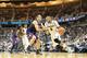 EAST LANSING, MI - FEBRUARY 13: Adreian Payne #5 of the Michigan State Spartans drives the ball to the basket as Alex Olah #22 of the Northwestern Wildcats defends during the second half of the game at Breslin Center on February 13, 2014 in East Lansing,