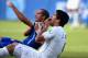 Suarez checks his teeth as Chiellini displays the wound on his shoulder.