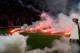 ROME, ITALY - MAY 03: SSC Napoli fans throw flares before the TIM Cup final match between ACF Fiorentina and SSC Napoli at Olimpico Stadium on May 3, 2014 in Rome, Italy. (Photo by Paolo Bruno/Getty Images)