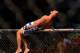 Feb 15, 2014; Jaragua do Sul, SC, Brazil; Charles Oliveira (red gloves) reacts after defeating Andy Ogle (blue gloves) during UFC Fight Night Machida vs Mousasi at Arena Jaragua. Mandatory Credit: Jason Silva-USA TODAY Sports