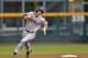 OMAHA, NE - JUNE 24: Mike Papi #38 of the Virginia Cavaliers runs to third base against the Vanderbilt Commodores in the sixth inning during game two of the College World Series Championship Series on June 24, 2014 at TD Ameritrade Park in Omaha, Nebrask