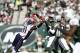 EAST RUTHERFORD, NJ - OCTOBER 20: Geno Smith #7 of the New York Jets passes under pressure from Jamie Collins #91 of the New England Patriots during their game at MetLife Stadium on October 20, 2013 in East Rutherford, New Jersey. (Photo by Jeff Zeleva