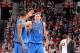 PORTLAND, OR - DECEMBER 7: Monta Ellis #11 and Dirk Nowitzki #41 of the Dallas Mavericks celebrate against the Portland Trail Blazers on December 7, 2013 at the Moda Center Arena in Portland, Oregon. NOTE TO USER: User expressly acknowledges and agrees t