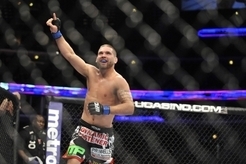 Jan 25, 2014; Chicago, IL, USA; Darren Elkins (red gloves) reacts after beating Jeremy Stephens (not pictured) during UFC on FOX 10 at the United Center. Mandatory Credit: David Banks-USA TODAY Sports
