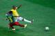 BRASILIA, BRAZIL - JUNE 23: Fernandinho of Brazil scores his team's fourth goal against Nicolas N'Koulou of Cameroon during the 2014 FIFA World Cup Brazil Group A match between Cameroon and Brazil at Estadio Nacional on June 23, 2014 in Brasilia, Brazil.