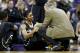 Jan 12, 2014; Seattle, WA, USA; Colorado Buffaloes guard Spencer Dinwiddie (25) is consoled by head coach Tad Boyle after suffering an injury during the first half against the Washington Huskies at Alaska Airlines Arena at Hec Edmundson Pavilion. Mandator