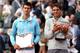 PARIS, FRANCE - JUNE 08: Rafael Nadal of Spain holds the Coupe de Mousquetaires as he poses with Novak Djokovic of Serbia after their men's singles final match on day fifteen of the French Open at Roland Garros on June 8, 2014 in Paris, France. (Photo b