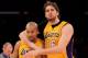 LOS ANGELES, CA - JANUARY 16: Derek Fisher #2 of the Los Angeles Lakers celebrates with Pau Gasol #16 after Fisher stole the ball and scored a break away basket against the Dallas Mavericks at Staples Center on January 16, 2012 in Los Angeles, California