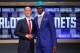 Jun 26, 2014; Brooklyn, NY, USA; Noah Vonleh (Indiana) shakes hands with NBA commissioner Adam Silver after being selected as the number nine overall pick to the Charlotte Hornets in the 2014 NBA Draft at the Barclays Center. Mandatory Credit: Brad Penner