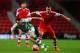 SOUTHAMPTON, ENGLAND - JANUARY 25: James Hayter (L) of Yeovil Town and Morgan Schneiderlin (R) of Southampton challenge for the ball during the FA Cup Fourth Round match between Southampton and Yeovil Town at St Mary's Stadium on January 25, 2014 in South