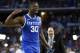 Apr 5, 2014; Arlington, TX, USA; Kentucky Wildcats forward Julius Randle (30) celebrates after defeating the Wisconsin Badgers in the semifinals of the Final Four in the 2014 NCAA Mens Division I Championship tournament at AT&T Stadium. Mandatory Credit:
