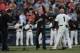 Oct 15, 2012; San Francisco, CA, USA; Grateful Dead band members Phil Lesh (left) and Bob Weir (center) perform the national anthem with San Francisco Giants third base coach Tim Flannery (1) before game two of the 2012 NLCS against the St. Louis Cardinal
