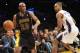 January 31, 2014; Los Angeles, CA, USA; Los Angeles Lakers shooting guard Jodie Meeks (20) controls the ball against the defense of Charlotte Bobcats point guard Ramon Sessions (7) during the second half at Staples Center. Mandatory Credit: Gary A. Vasque